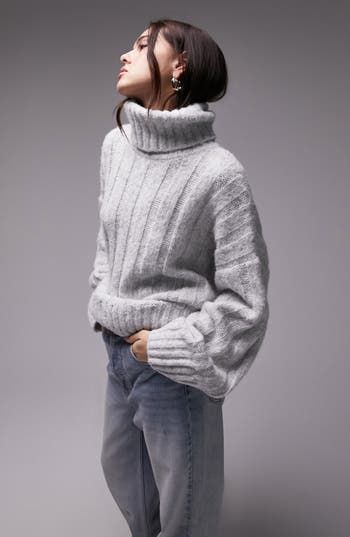 A chunky turtleneck lends cozy energy to this wide-ribbed sweater with a relaxed fit for unbeatable comfort. 28 1/2" length (size medium) Turtleneck Long sleeves 85% polyester, 15% acrylic Machine wash, line dry Imported Chunky Turtleneck Sweater, Rib Sweater, Ribbed Turtleneck Sweater, Pullover Outfit, Grey Turtleneck, Ladies Turtleneck Sweaters, Fall Capsule Wardrobe, Womens Turtleneck, Ribbed Turtleneck