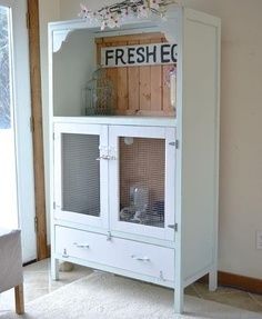 a white cabinet sitting in the corner of a room