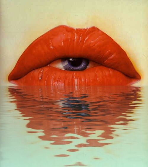 a woman's eye is reflected in the water with red lipstick on her lips