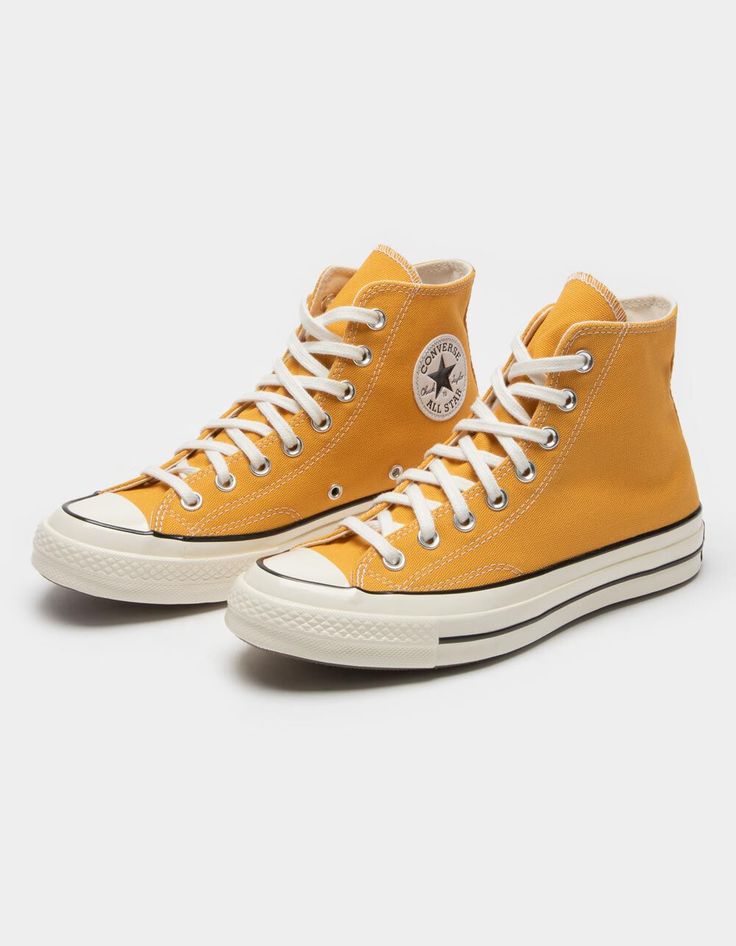 Converse Chuck 70 High Top Shoes. More Cushioning, Tougher Canvas, Same Versatility. The Chuck 70 High Top Is Built Off Of The Original 1970s Design, With Premium Materials And An Extraordinary Attention To Detail. We Added An Extra Cushy Insole For Arch Support And Stability, And Used Wing Tongue Stitching On 12oz Canvas For Durability. No Reason Not To Wear Them All Day, Every Day. Lace Up Closure. Metal Grommets. Canvas Upper. Ortholite Insole. Rubber Outsole. Vintage License Plate At Back Of Yellow High Top Converse, Colored Converse, Converse Chuck 70 High Top, Converse Yellow, Chuck 70 High Top, Cute Converse Shoes, Shoes Png, Yellow Converse, Cute Converse