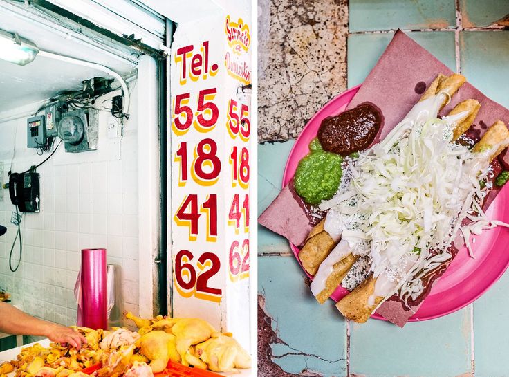 a woman standing in front of a plate of food on a counter next to a sign