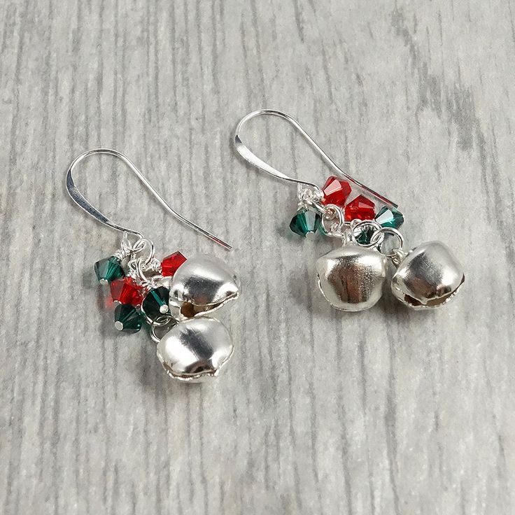 Get holiday ready in no time with these adorable jingle bell earrings. Pair these earrings with a cream sweater and grey wool pants for a refined and sophisticated holiday look. These make a great gift for your child's teacher or as a stocking stuffer for mom. Size: 1.5" long, 4mm crystals, 9mm bells (these really do jingle!) Materials: glass crystals Metals: silver plated charms and choose between silver plated and sterling silver earwires Grey Wool Pants, Hot Earrings, Christmas Jewelry Diy, Stocking Stuffers For Mom, Gifts For Women Birthday, Bell Earrings, Long Silver Earrings, Winter Earrings, Earring Trends