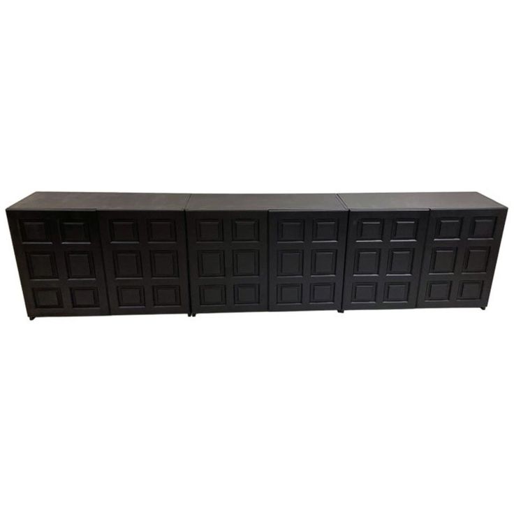 a black cabinet with four doors on it