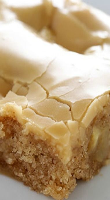 a piece of cake sitting on top of a white plate covered in frosted icing