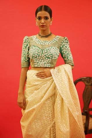 Emerald green blouse adorned with artisanal hand-embroidery of resham and golden dori in floral pattern - Aza Fashions Chikankari Embroidery Chanderi Blouse For Reception, Designer Brocade Saree With Resham Embroidery, Reception Blouse With Chikankari Embroidery In Traditional Drape, Wedding Blouse With Chikankari Embroidery In Art Silk, Bollywood Style Blouse With Chikankari Embroidery In Art Silk, Art Silk Blouse With Chikankari Embroidery For Wedding, Festive Brocade Pre-draped Saree With Unstitched Blouse, Wedding Art Silk Blouse With Chikankari Embroidery, Festive Pre-draped Brocade Saree With Unstitched Blouse