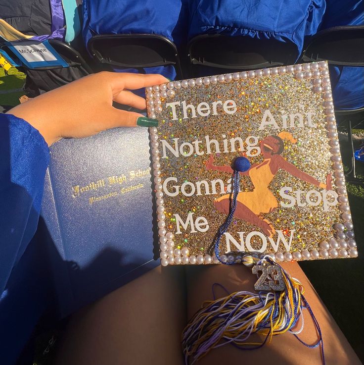 there is a person holding a book in their lap with the words, there is nothing and going me now on it