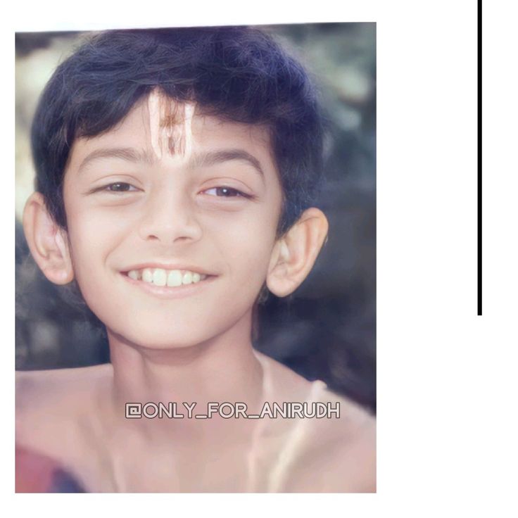 an image of a young boy with white lines on his face and chest, smiling