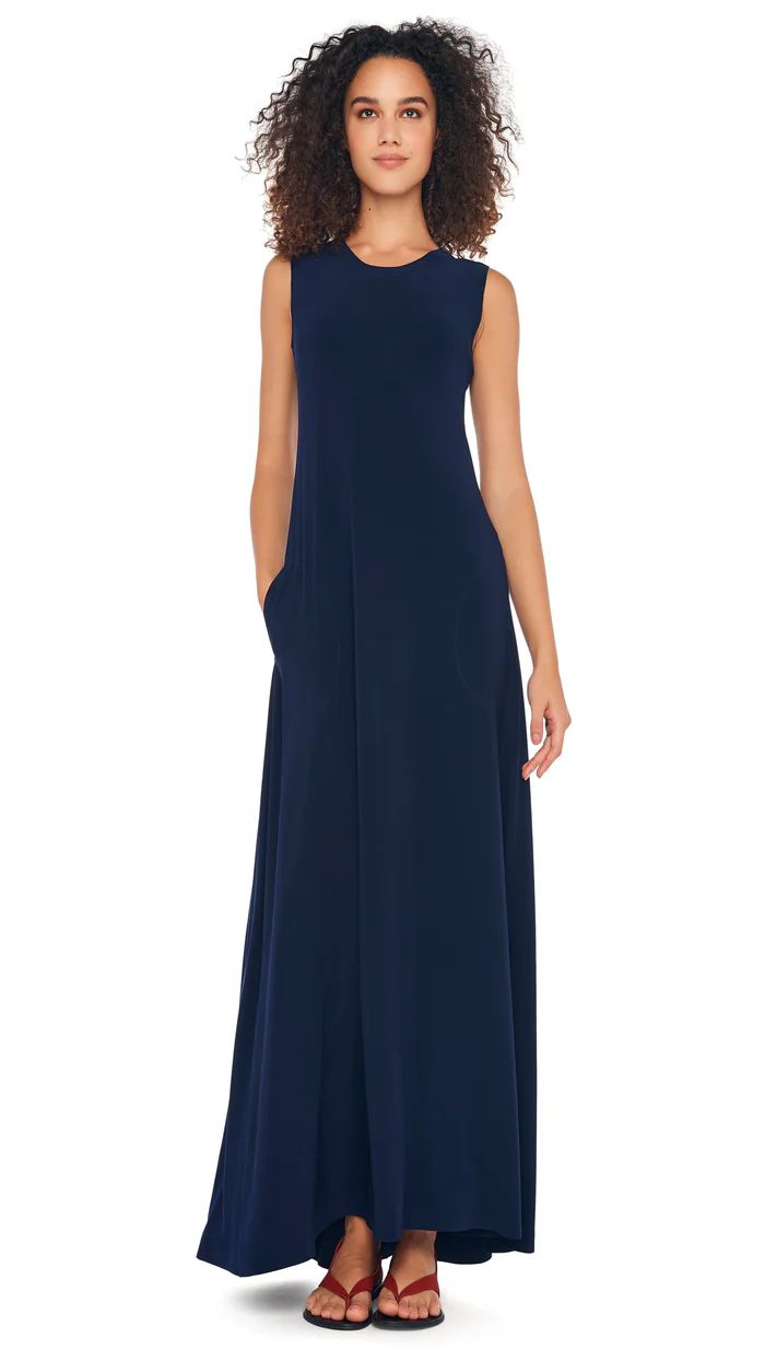 SLEEVELESS SWING MAXI DRESS – True Navy – Norma Kamali Solid Sleeveless Elastane Maxi Dress, Sleeveless Stretch Dress With Pockets, Stretch Sleeveless Dress With Pockets, Sleeveless Stretch Maxi Dress For Daywear, Stretch Sleeveless Maxi Dress For Daywear, Elegant Sleeveless Dresses With Side Pockets, Sleeveless Workwear Dresses With Slip Pockets, Fitted Sleeveless Dresses With Side Pockets, Sleeveless Four-way Stretch Maxi Dress