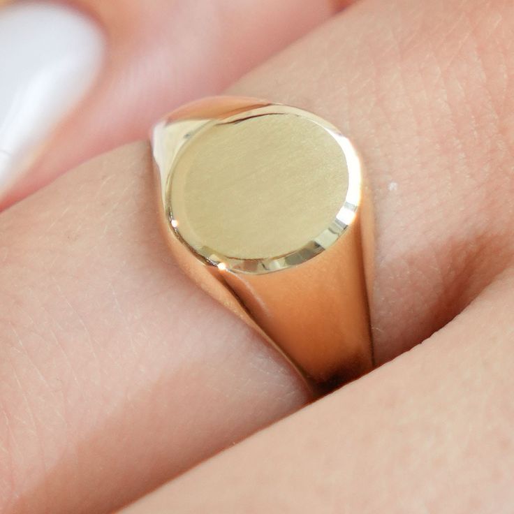 Celebrate your style with this engravable ring. The polished oval signet ring is crafted in solid 14K yellow gold, and is the perfect way to add some elegance to your everyday look. The initial of your choice can be elegantly engraved on the front of the ring for a personal touch that's sure to stand out. ✨Product Specifics✨ All specifications are approximate and may vary for the same model. Metal: Yellow Gold Metal Purity: 14K Finish: High Polished Ring Width: 13.5mm Weight: 2.3g Ring Style: Signet Style ID: 10769 ✨Why Shop With WJDNYC?✨ 💎 Free gift box included. 💎High quality materials. 💎Attention to details with every order. 💎100% custom satisfaction. ✨Shipping✨ 🎁 Orders are shipped within 1-2 business days. 🎁 FREE SHIPPING on all orders. 🎁 Expedited shipping methods are availabl Oval Signet Ring, Bamboo Hoop Earrings, Signet Rings, Photo Pendant, Ring Style, Shipping Orders, Engraved Rings, Signet Ring, Gold Bands