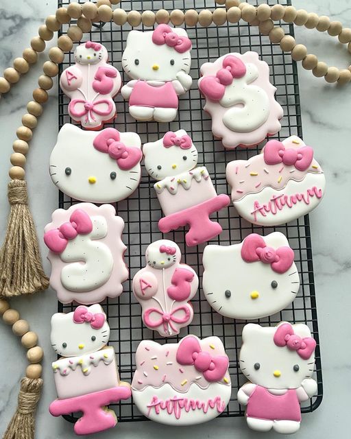 hello kitty cookies on a cooling rack with tassels