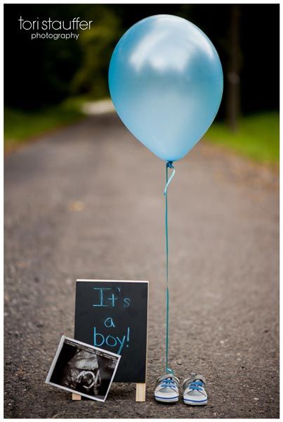 a blue balloon is tied to a sign