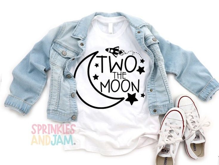 two the moon t - shirt and sneakers on top of each other, next to an empty pair of shoes