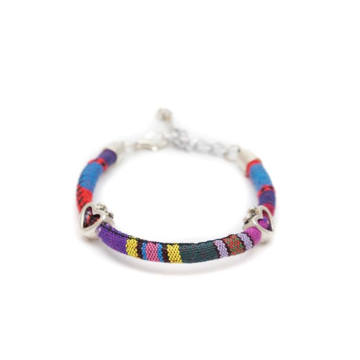 These fun, casual, and gorgeous bracelets are one of our best sellers and are perfect for adding some 'boho flair' to any outfit! Each piece features beautiful and colorful Guatemalan fabric wrapped around a bracelet that is detailed with silver beaded accents. Wear one or stack them - collect them all! As always... Handmade and Fair Trade! 7 1/2" L 100% Cotton Fabric Silver Beads and Clasp Colors/Patterns Will Vary Price is for one random Bohemian Fabric and Bead Bracelet WARNING: CHOKING HAZAR Bohemian Silver Friendship Bracelets With Beads, Bohemian Silver Beaded Friendship Bracelets, Bohemian Silver Friendship Bracelets With Silver Beads, Bohemian Jewelry With Silver Beads For Friendship, Bohemian Silver Beaded Jewelry For Friendship, Adjustable Multicolor Wrap Bracelet, Hippie Multicolor Beaded Wrap Bracelet, Bohemian Multicolor Bracelets For Summer, Bohemian Braided Bracelets With Colorful Beads