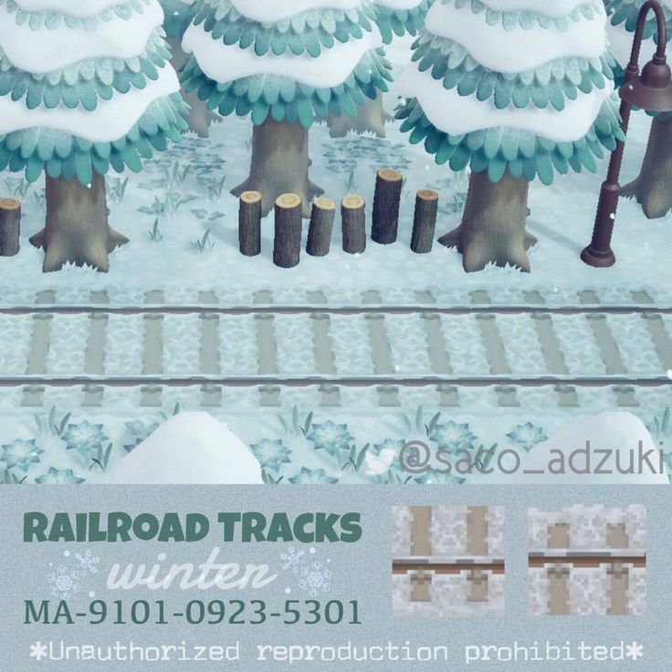 the railroad tracks are covered in snow and trees with umbrellas on them for winter