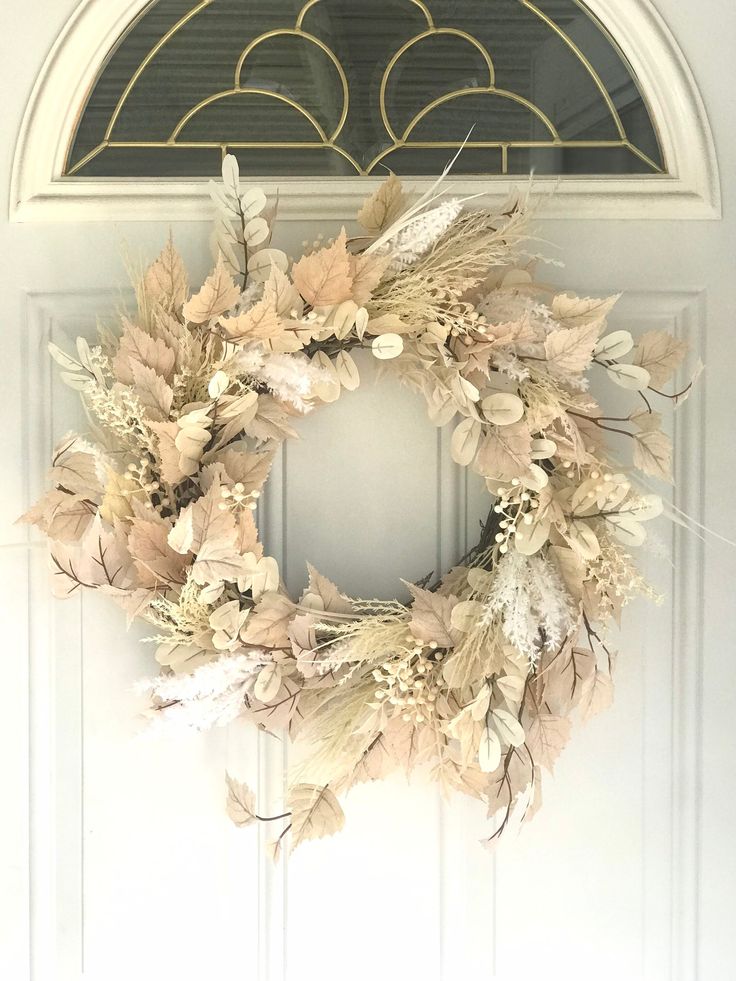 a wreath is hanging on the front door