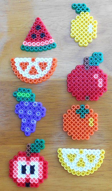 several perler beads are arranged on a table