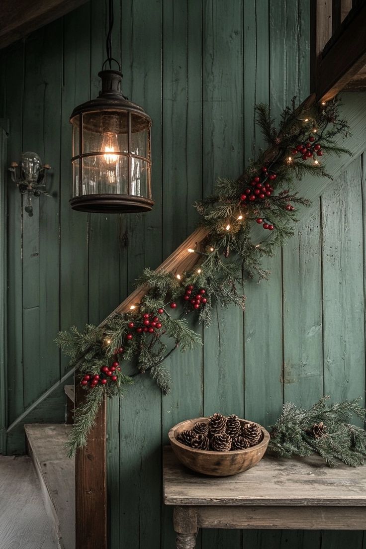 a wooden table topped with a basket filled with pine cones next to a light fixture