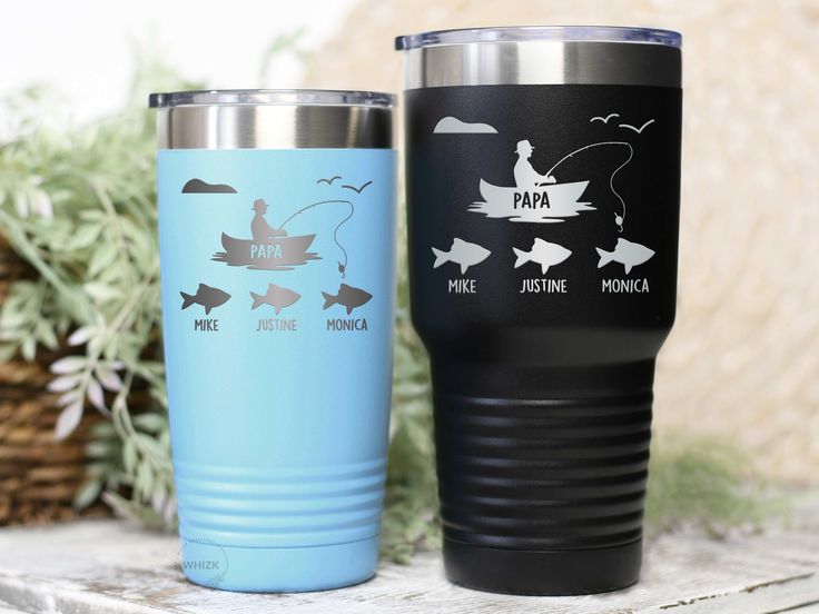 two travel mugs one with fishing and the other with dad's fish on it