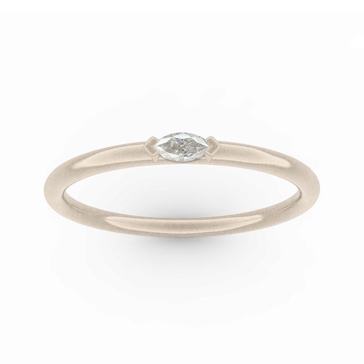 Introducing the Stella ring - a sleek and contemporary stacking band adorned with a captivating marquise diamond. Its delicate sparkle adds a touch of understated elegance to any look. Named after the Italian word for star, this versatile piece is ideal for everyday wear or as a distinctive wedding or anniversary band. Diamond is 4mmx2mm .08 cts. Modern Stackable Rings With Single Diamond For Promise, Minimalist Oval Diamond Stackable Rings, Modern Stackable Promise Ring With Single Diamond, Modern Marquise Diamond Ring For Formal Occasions, White Gold Marquise Diamond Promise Ring, White Gold Marquise Diamond Ring, Modern Stackable Single Diamond Promise Ring, Elegant Marquise Ring With Single Diamond, Modern Oval Diamond Stackable Rings