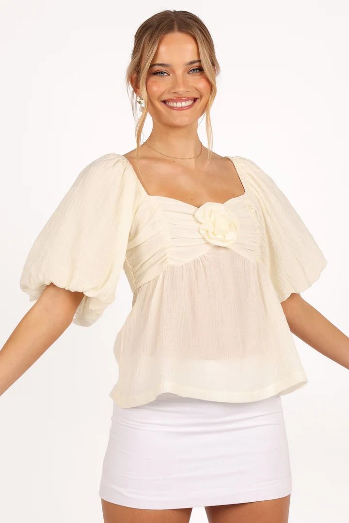 Emerson Rosette Top - Ivory - Petal & Pup USA Elegant Top With Smocked Bodice And Square Neck, Elegant Tops With Smocked Bodice And Square Neck, Chic White Puff Sleeve Top With Square Neck, Elegant Square Neck Blouse For Brunch, Chic Beige Square Neck Blouse, Elegant Smocked Top With Square Neck And Ruffles, Elegant Smocked Top With Square Neck For Summer, Elegant Smocked Top With Ruffles And Square Neck, Elegant Summer Smocked Top With Square Neck