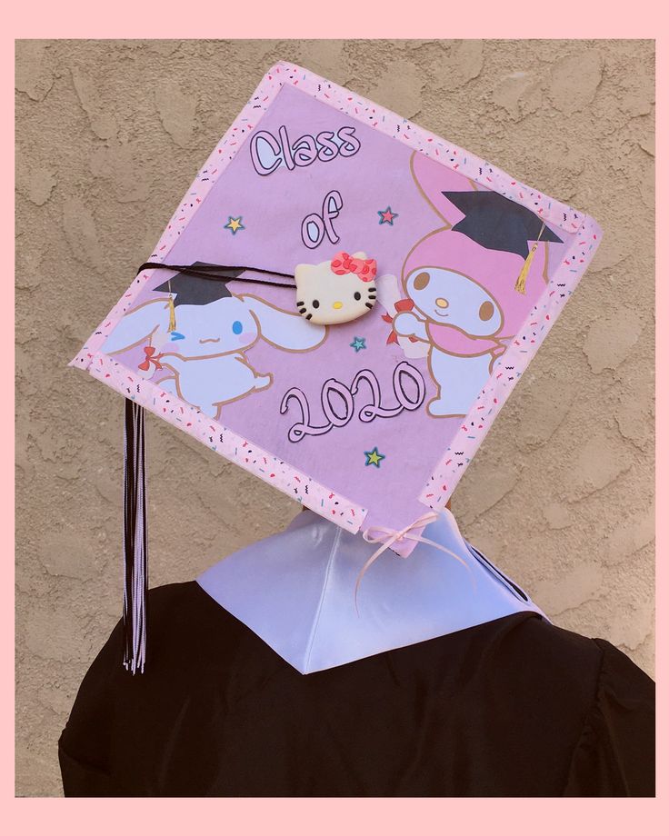 a graduation cap with hello kitty on it