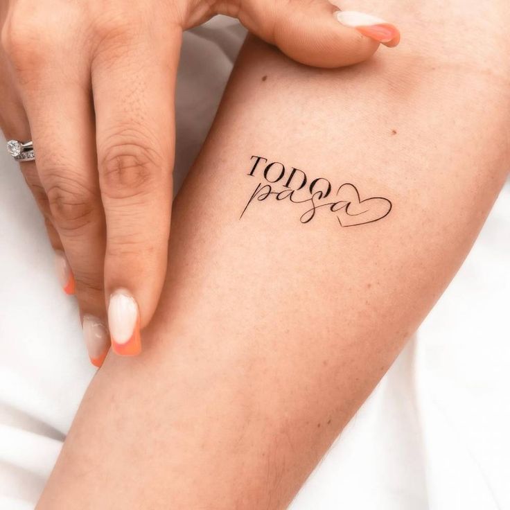 a woman's arm with the word hope written in cursive writing on it