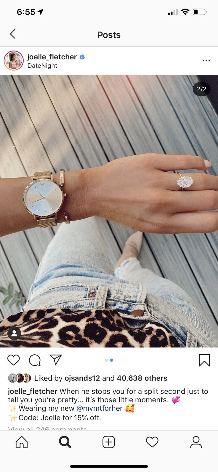 a woman's hand with two different rings on it, and the other one is wearing