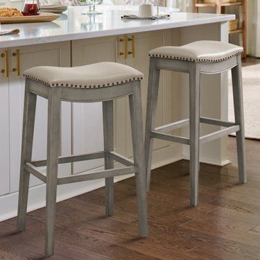 two stools in front of a kitchen island