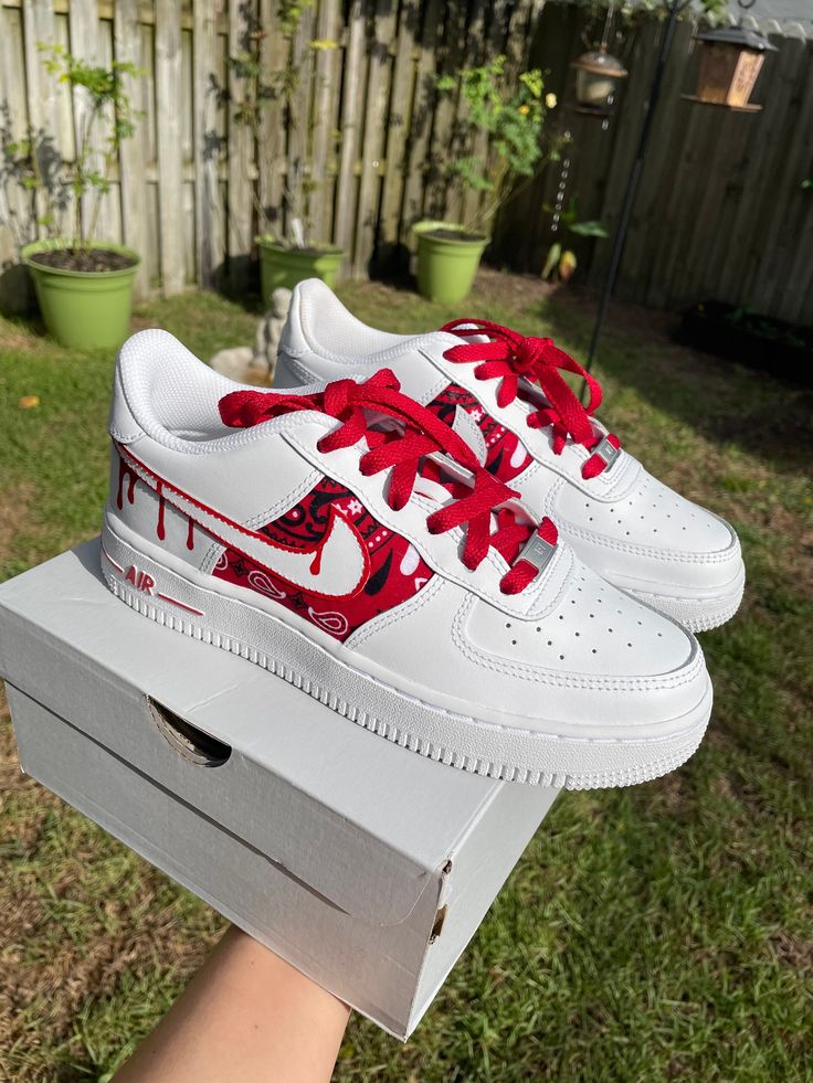 Custom Bandana Air Force 1's  All customs made to order, message for other sizes and colors or variations of the example listed All orders made and shipped in 5-10 business days  ALL SALES ARE FINAL. PLEASE READ ENTIRE DESCRIPTION: GENERAL All shoes are 100% authentic. Custom fabrics are attached by hand. Custom paint jobs are done by hand. Designs are permanent and water resistant. Due to the custom nature of the products, returns and exchanges are not accepted. PROCESSING Days of operation are Monday to Friday. Average processing time is 3-5 days business days. We reserve up to 14 days to process your order. Contact us with delivery expectations for gifts or other time sensitive orders. SHIPPING UPS is our default carrier. Tracking is emailed when your shoes are ready. If you purchase fr Embroidered Air Force 1, Bandana Shoes Diy, Custom Red Sneakers For Streetwear, Red Custom Sneakers For Streetwear, Custom Red Sneakers With Artwork, Custom Red Sneakers With Custom Artwork, Red Custom Sneakers With Custom Artwork, Red Custom Sneakers With Artwork, Customizable Red Sneakers For Streetwear