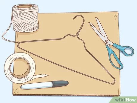 a pair of scissors, thread and yarn sitting on top of a piece of paper