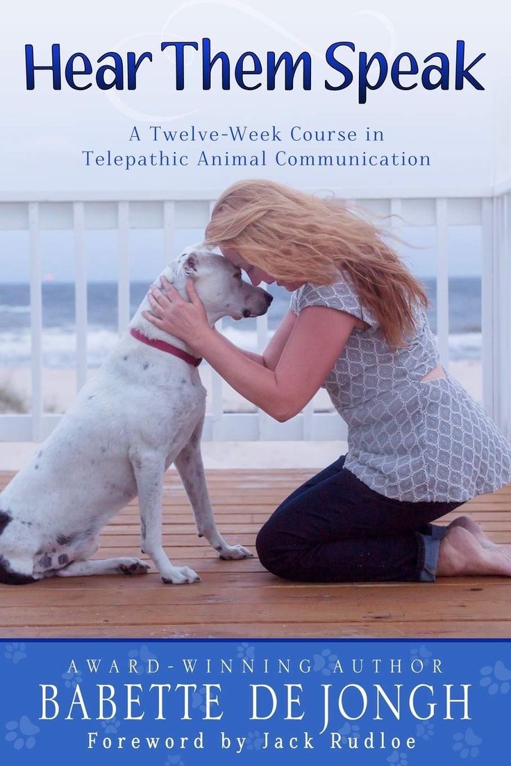 a woman kneeling down next to a white dog on top of a wooden floor with the words hear them speak