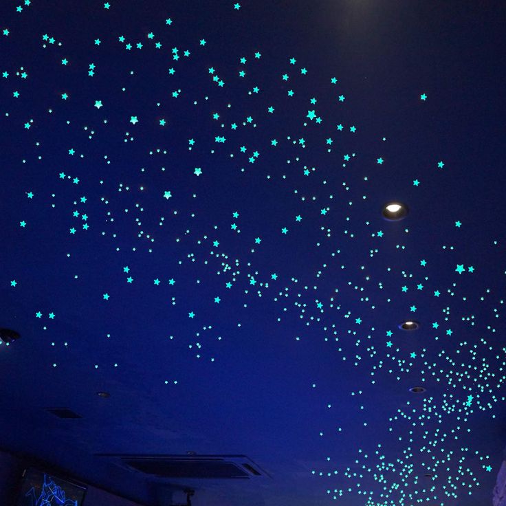 the ceiling is covered with blue stars and glows in the night sky, as well as street lights