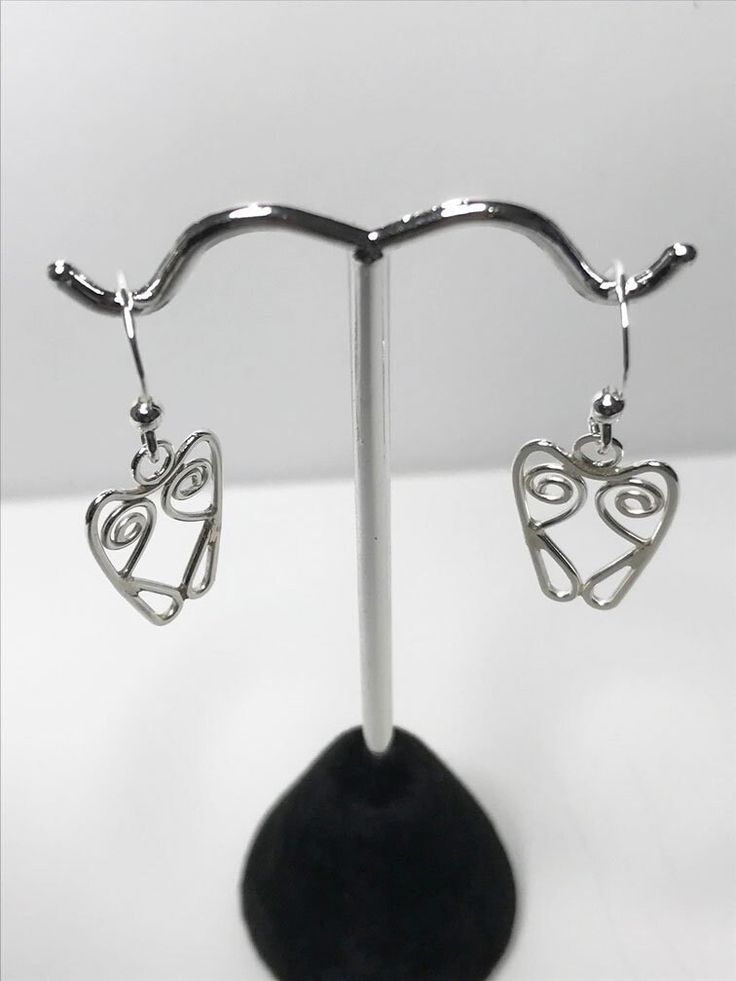 Made and formed from 1.00mm Sterling Silver wire. Using tradtional techniques. Artistic Wire Wrapped Drop Earrings, Adjustable Wire Wrapped Earrings For Anniversary, Artistic Hypoallergenic Silver Jewelry, Artistic Silver Metal Hoop Earrings, Modern Silver Heart Earrings For Gifts, Silver Wrap Earrings For Jewelry Making, Artistic Heart-shaped Sterling Silver Jewelry, Handmade Silver Wire Wrap Earrings, Handmade Silver Wire Jewelry