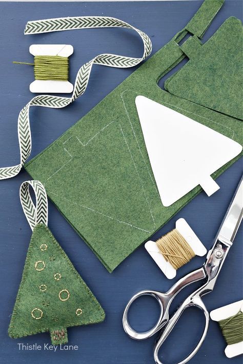 scissors, thread, and other crafting supplies laid out on a table