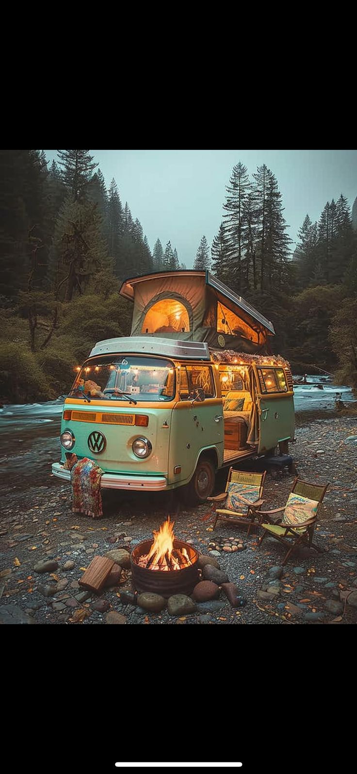 an old vw bus parked in front of a campfire