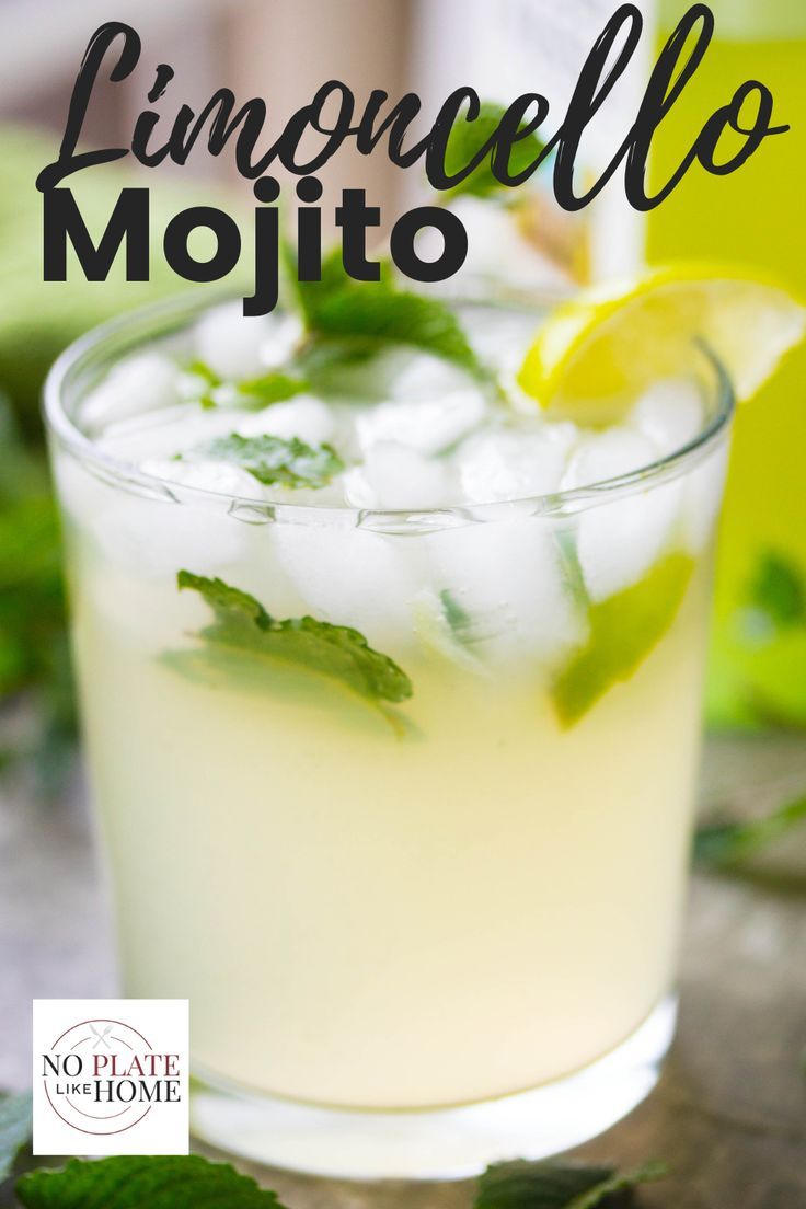 a glass filled with lemonade mojito sitting on top of a table