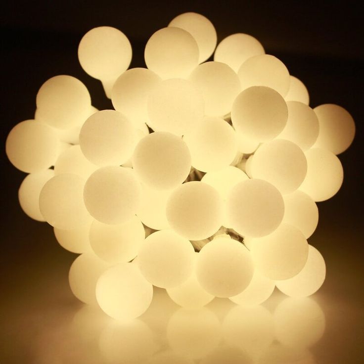 a light that is sitting on top of a white tablecloth with circles around it