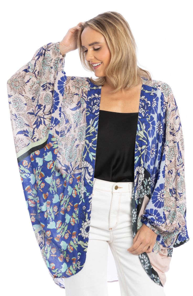 A mix of prints draws attention to a flowy ruana cut from lightweight fabric that elegantly sways with your every move. Shawl collar Long sleeves 100% modal Hand wash, line dry Imported Artisanal Design, Velvet Kimono, Kimono Pattern, Cashmere Wrap, Girls Shoes Kids, Fashion Marketing, Floral Kimono, Pashmina Scarf, Mixing Prints