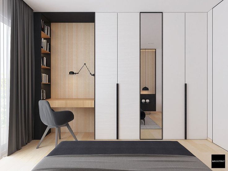 a bedroom with a bed, chair and bookshelf next to the closet doors