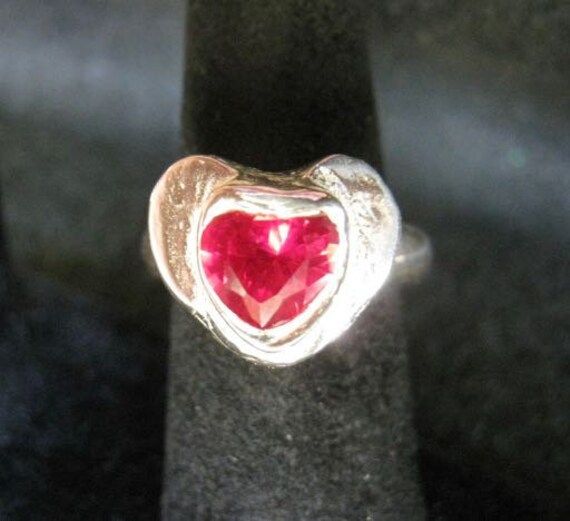 This is a one-of-a-kind heart gemstone ring that your loved one or friend is sure to treasure!  It lifts from the base of the band by 5 mm. This ring is formed from Art Clay Silver and is .999% silver. Silver Heart-shaped Birthstone Ring Gift, Oval Gemstone Heart Ring As Gift, Oval Gemstone Heart Ring For Gifts, Oval Jewelry For Valentine's Day Promise, Heart-shaped Gemstone Ring For Valentine's Day, Unique Heart Ring For Valentine's Day, Sterling Silver Heart Cut Birthstone Ring For Gift, Heart-shaped Silver Ruby Ring For Valentine's Day, Valentine's Day Silver Heart Birthstone Ring