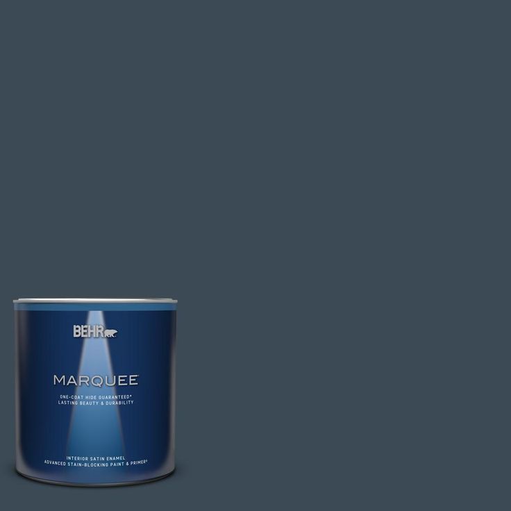 a can of marquee paint on a green background