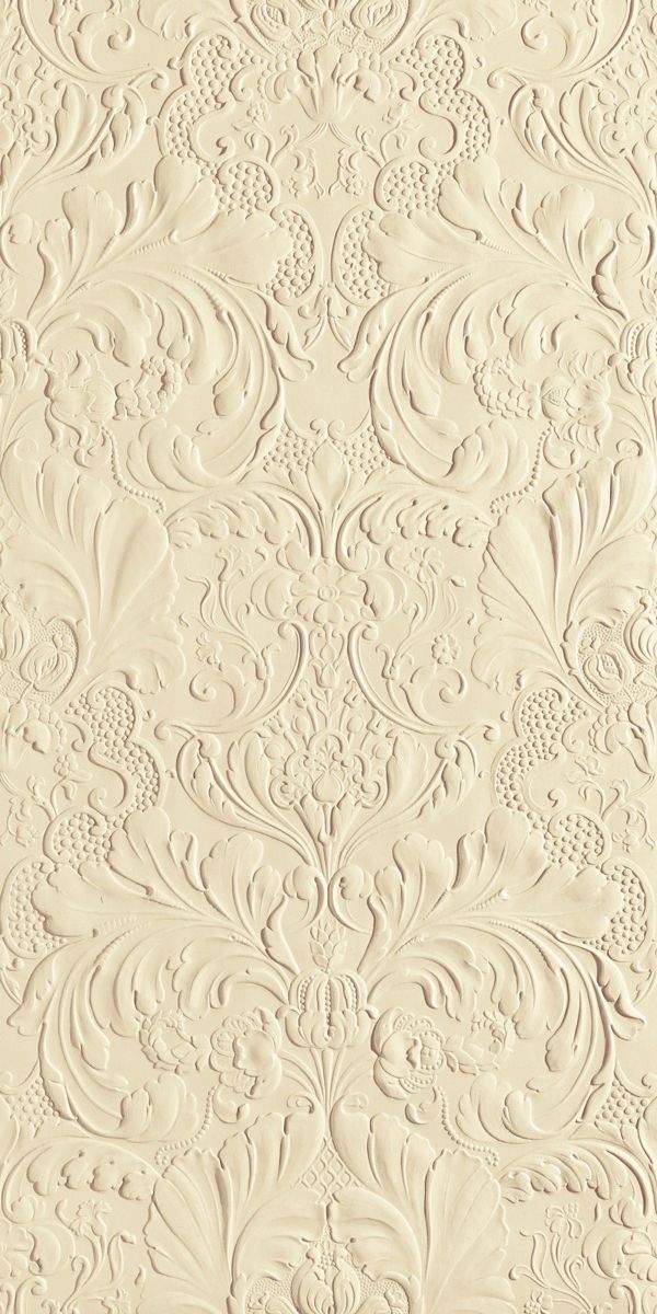 an ornate wallpaper pattern with white paint