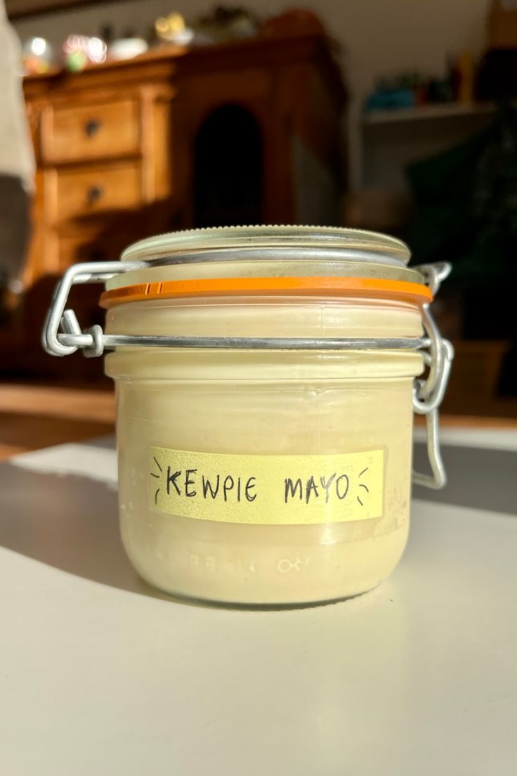 a jar with some writing on it sitting on a table