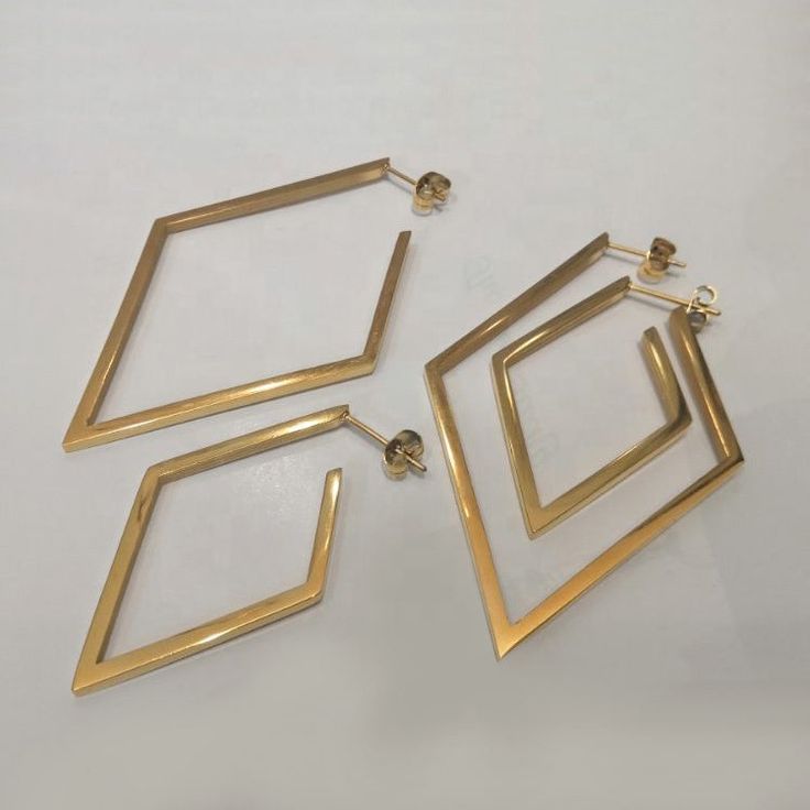 Introducing the Neva Earrings, the perfect addition to your jewelry collection. These stunning earrings feature a unique geometric design that is both modern and timeless. Crafted from high-quality stainless steel and plated with 18K gold, these earrings are durable and long-lasting. The Neva Earrings are lightweight and comfortable to wear, making them a great choice for everyday wear or special occasions. The delicate size of these earrings is perfect for adding a touch of elegance to any outf Geometric Metal Earrings For Everyday, Modern Geometric Pierced Earrings, Modern Gold Plug Earrings, Modern Geometric Hoop Earrings With Ear Wire, Modern Geometric Nickel-free Earrings, Modern Geometric Single Hoop Earring, Modern Yellow Gold Linear Earrings, Modern Nickel-free Geometric Earrings, Modern Geometric Metal Hoop Earrings