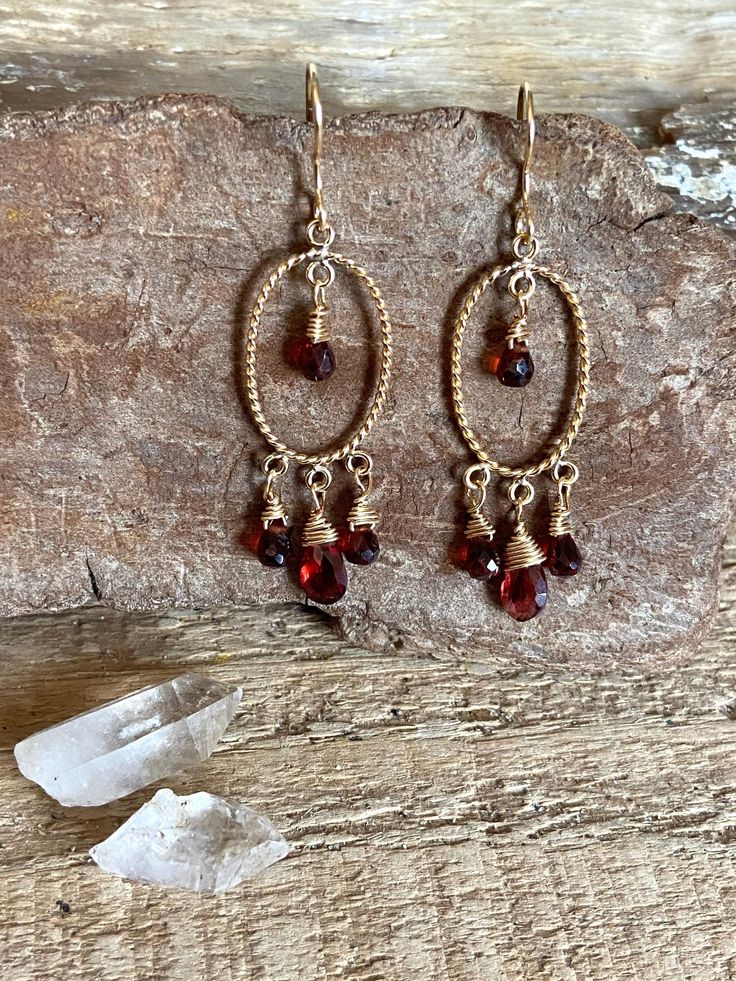 Gold filled chandelier earrings with faceted garnet gemstones Gold Faceted Dangle Chandelier Earrings, Gold Faceted Chandelier Dangle Earrings, Faceted Garnet Drop Earrings, Garnet Faceted Drop Earrings, Gold Garnet Teardrop Earrings, Gold Teardrop Garnet Earrings, Faceted Garnet Earrings In Gold, Gold Faceted Garnet Earrings, Gold Garnet Faceted Earrings