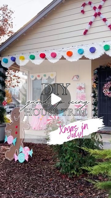 an image of a house decorated for christmas with decorations on the front door and windows