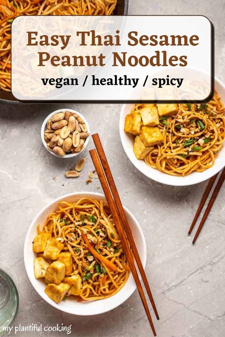 two bowls filled with noodles and vegetables next to chopsticks on a table top