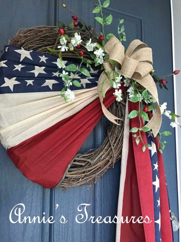 an american flag wreath hanging on the front door