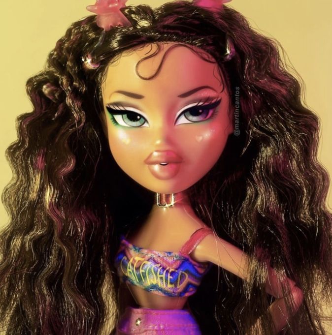 a close up of a barbie doll with long hair