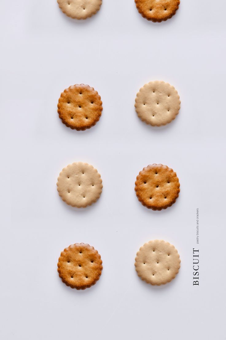 six crackers arranged in the shape of faces